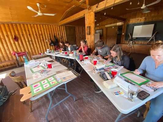 Participants painting with FUNTO watercolor kits at Star 6 Ranch