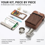 Fifteen-color EXPLORER Walnut kit contents with wooden palette, brown bag, journal and travel tools